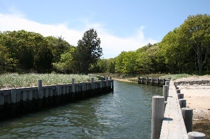 Undisclosed Address Sag Harbor, NY 11963 - Photo 4 of 12 a view of a wooden deck and lake