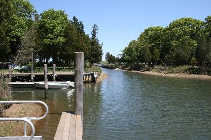 Undisclosed Address Sag Harbor, NY 11963 - Photo 5 of 12 a view of a swimming pool with a lake view