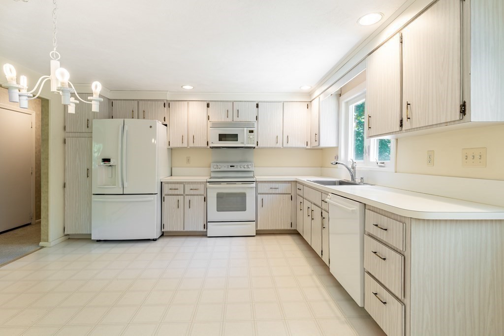 35 Williams Road Sharon, MA 02067 - Photo 9 of 25 a kitchen with stainless steel appliances a white cabinets and a sink