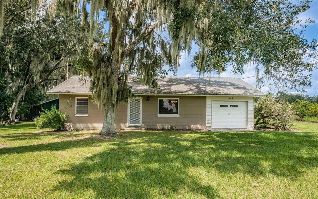 1049 Jameson Road Lithia, FL 33547 - Photo 1 of 43 a front view of a house with yard