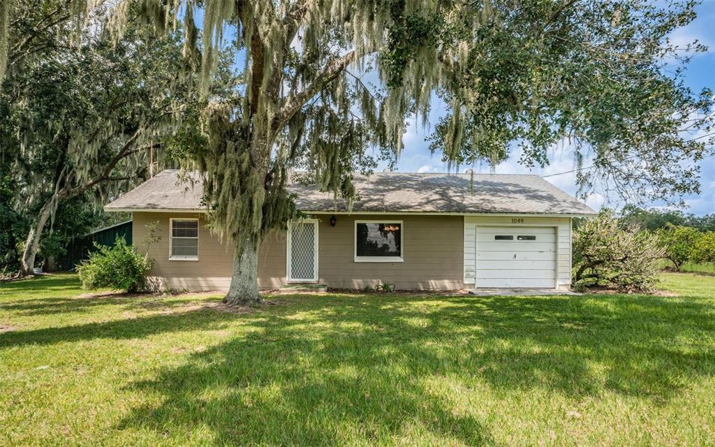 a front view of a house with yard