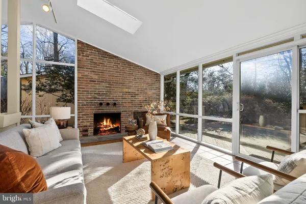 a outdoor living space with patio furniture and a fireplace