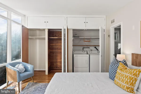 a bedroom with a bed and a chair