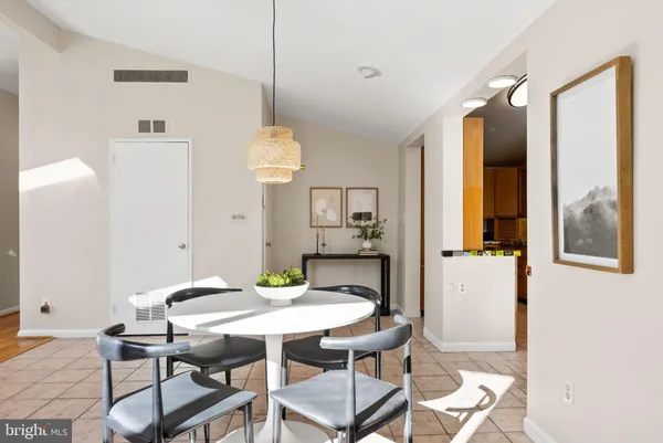 a view of a dining room with furniture and window