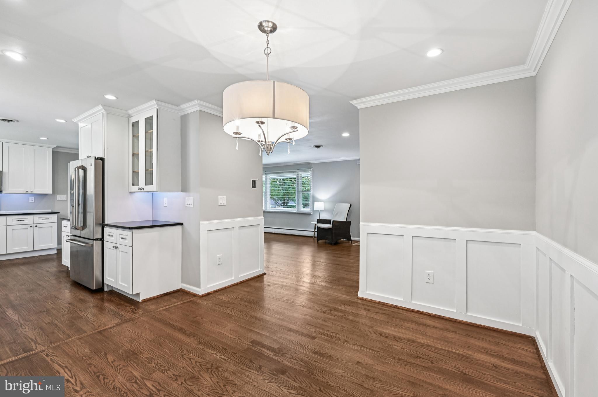 536 Maple Ridge Lane Odenton, MD 21113 - Photo 13 of 48 a view of a kitchen with a sink refrigerator and wooden floor