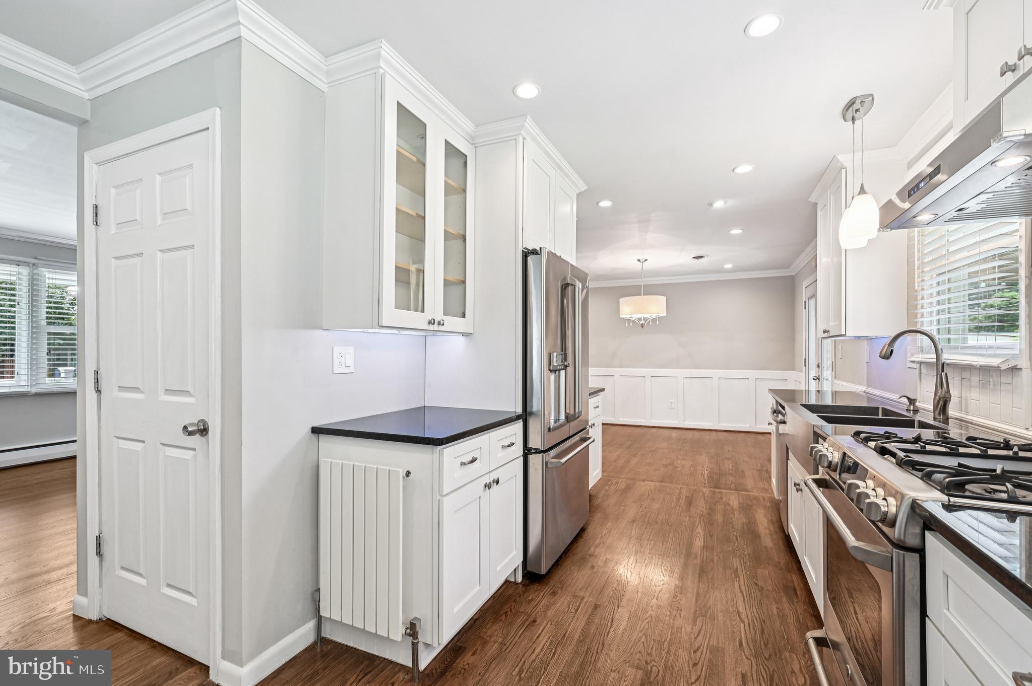 536 Maple Ridge Lane Odenton, MD 21113 - Photo 15 of 48 a kitchen with granite countertop a stove and a refrigerator