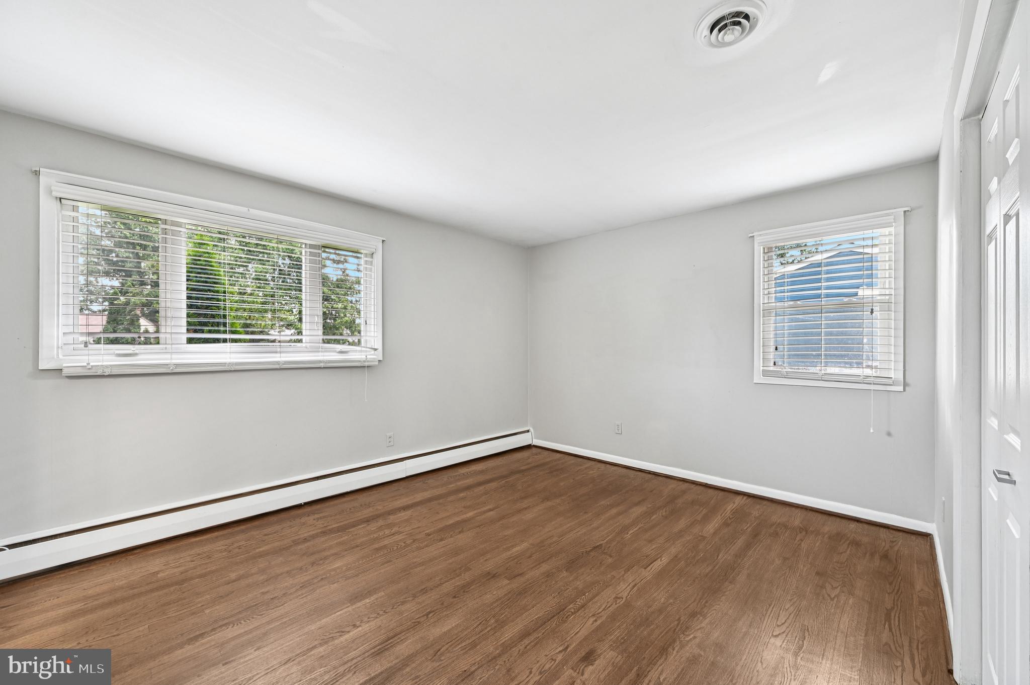 536 Maple Ridge Lane Odenton, MD 21113 - Photo 17 of 48 an empty room with wooden floor and windows