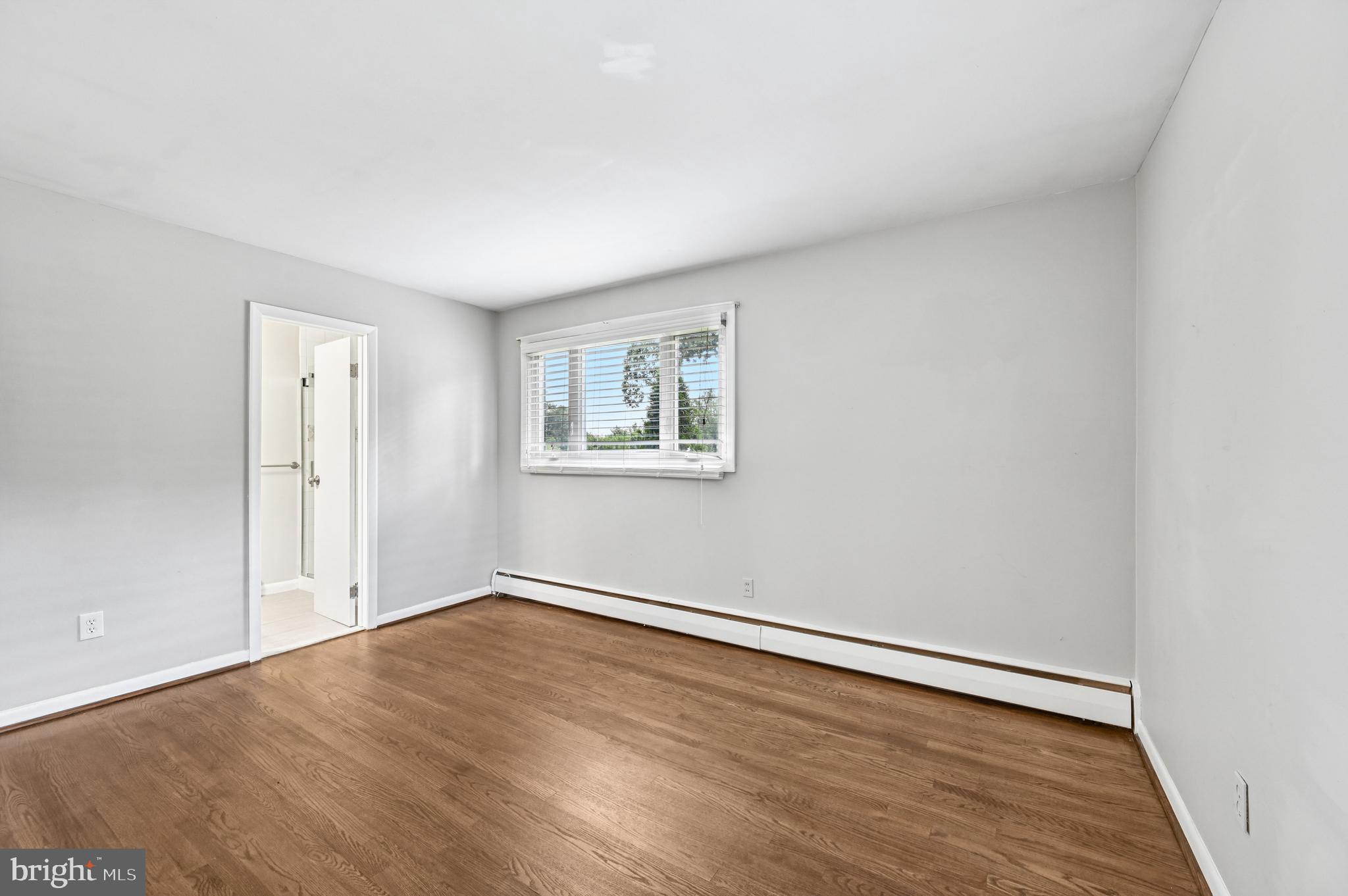 536 Maple Ridge Lane Odenton, MD 21113 - Photo 19 of 48 an empty room with wooden floor and windows