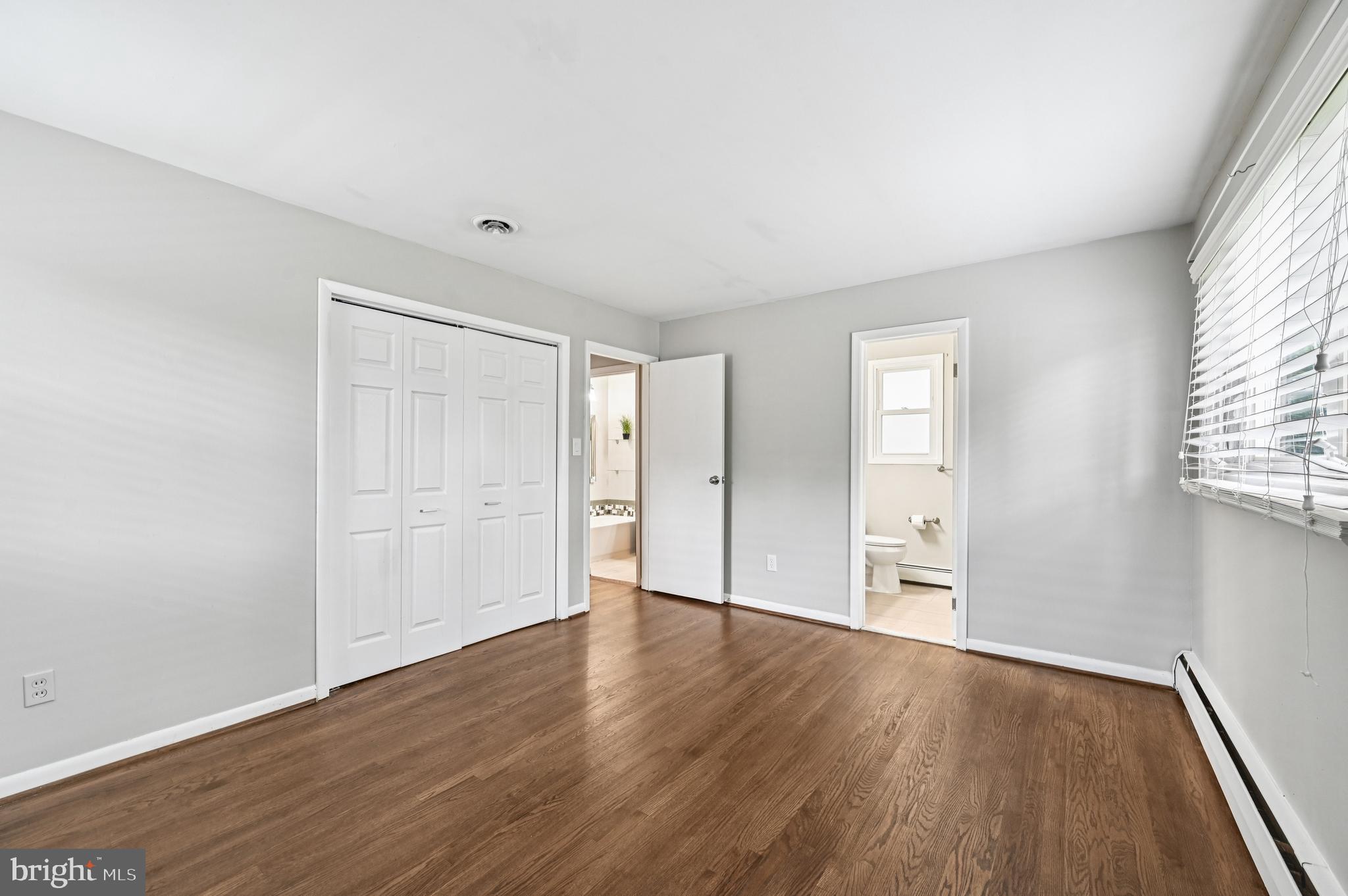 536 Maple Ridge Lane Odenton, MD 21113 - Photo 20 of 48 wooden floor in an empty room with a window