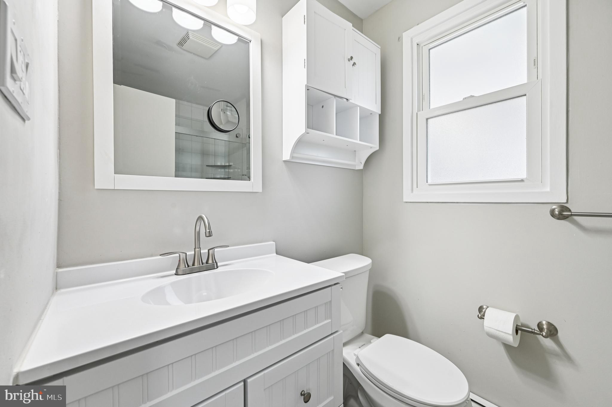 536 Maple Ridge Lane Odenton, MD 21113 - Photo 21 of 48 a bathroom with a toilet sink and mirror