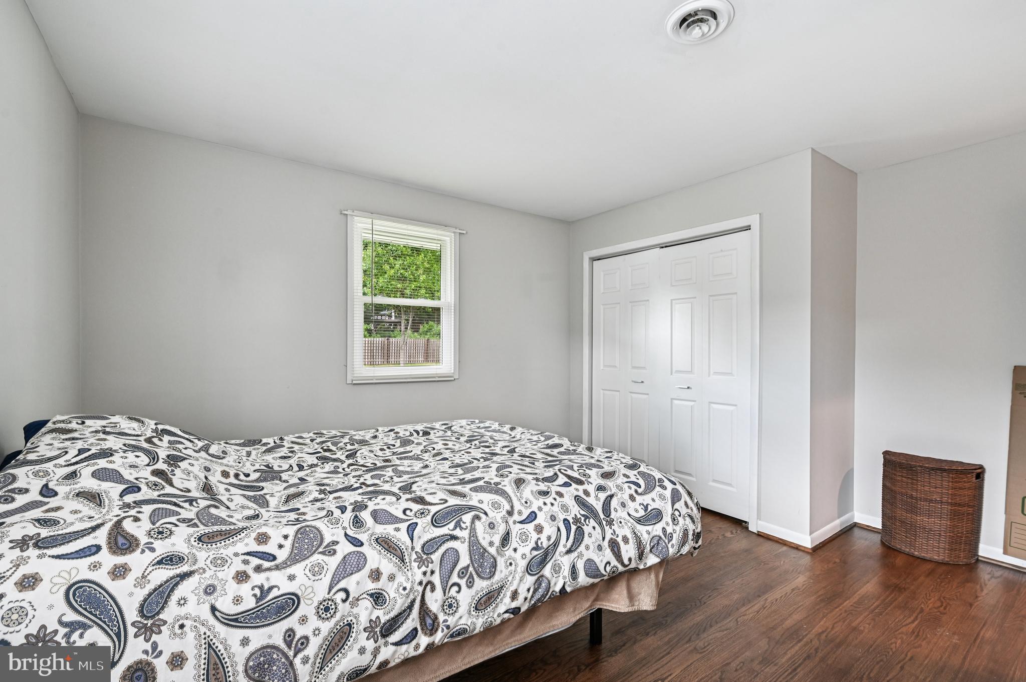 536 Maple Ridge Lane Odenton, MD 21113 - Photo 28 of 48 a bedroom with a bed and wooden floor