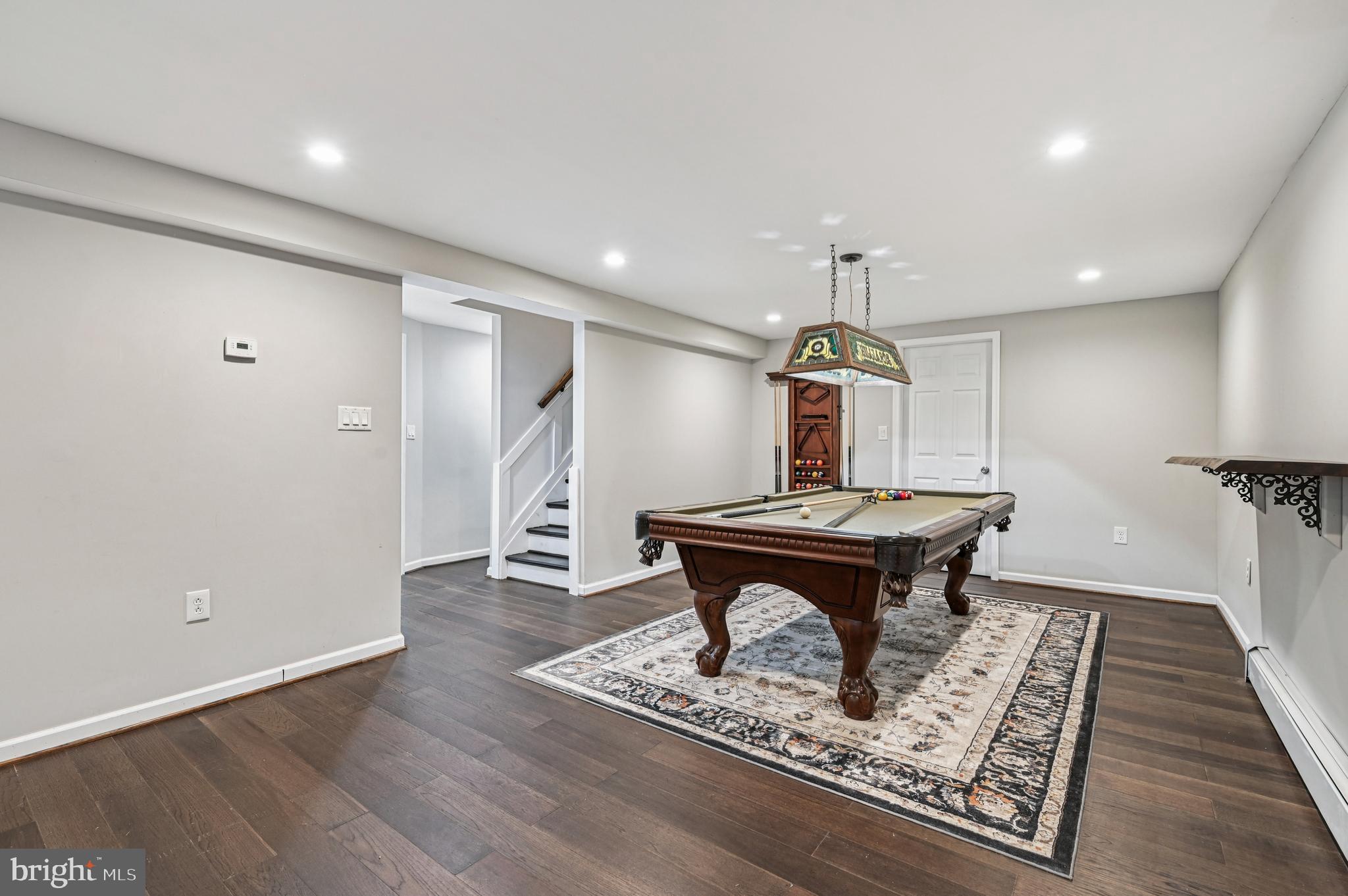 536 Maple Ridge Lane Odenton, MD 21113 - Photo 31 of 48 a room with wooden floor pool table and windows