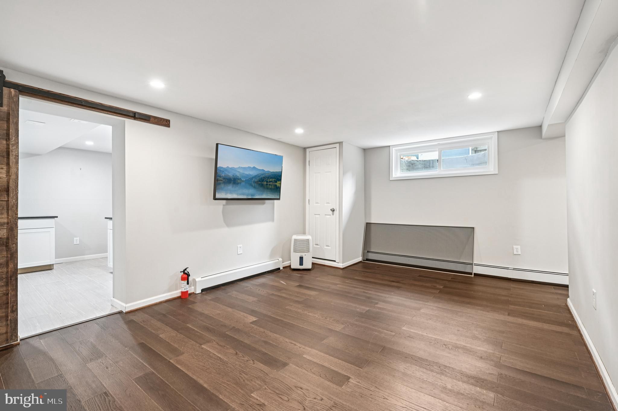 536 Maple Ridge Lane Odenton, MD 21113 - Photo 32 of 48 an empty room with wooden floor and windows