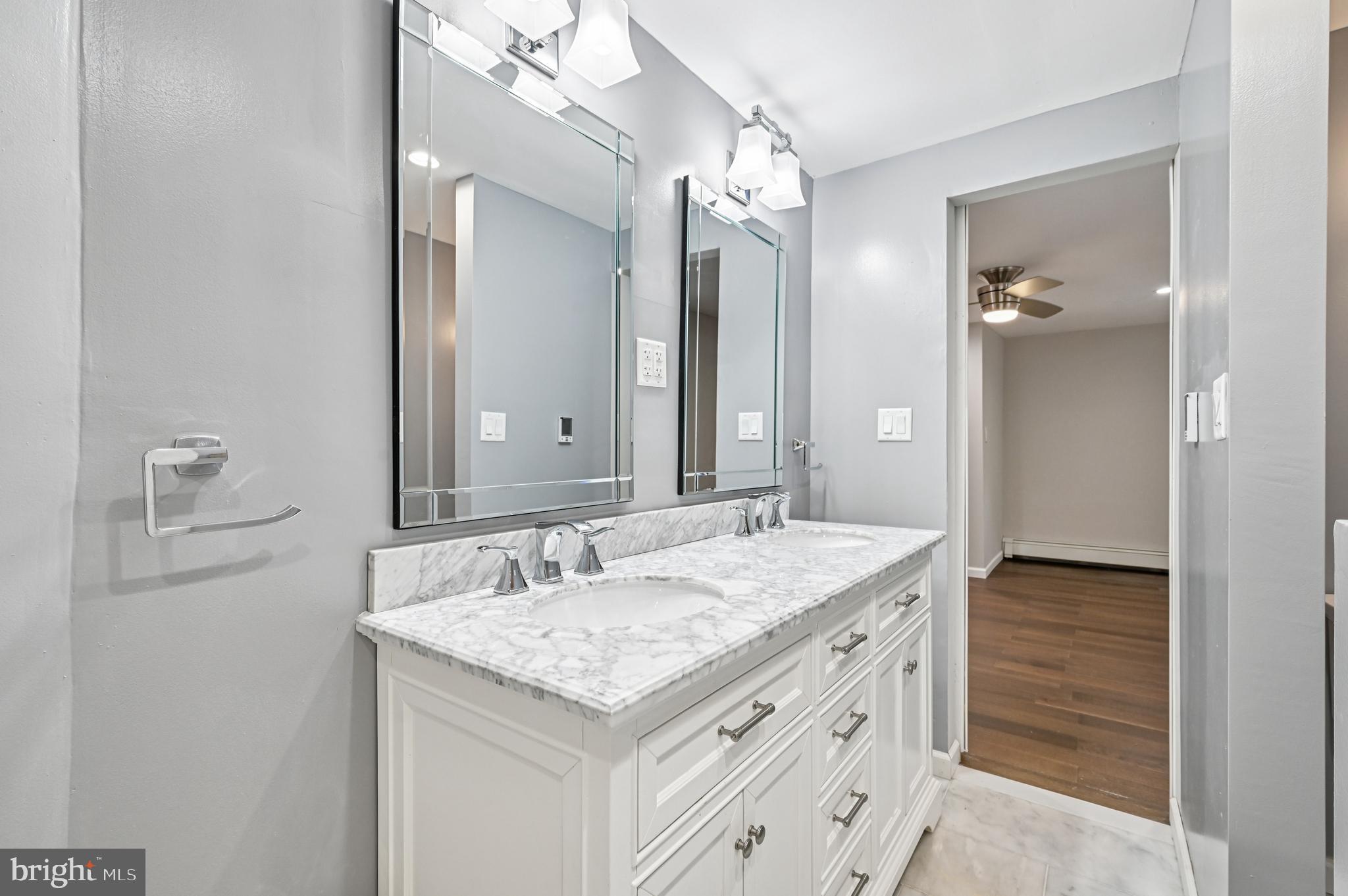536 Maple Ridge Lane Odenton, MD 21113 - Photo 40 of 48 a bathroom with a granite countertop sink and a mirror