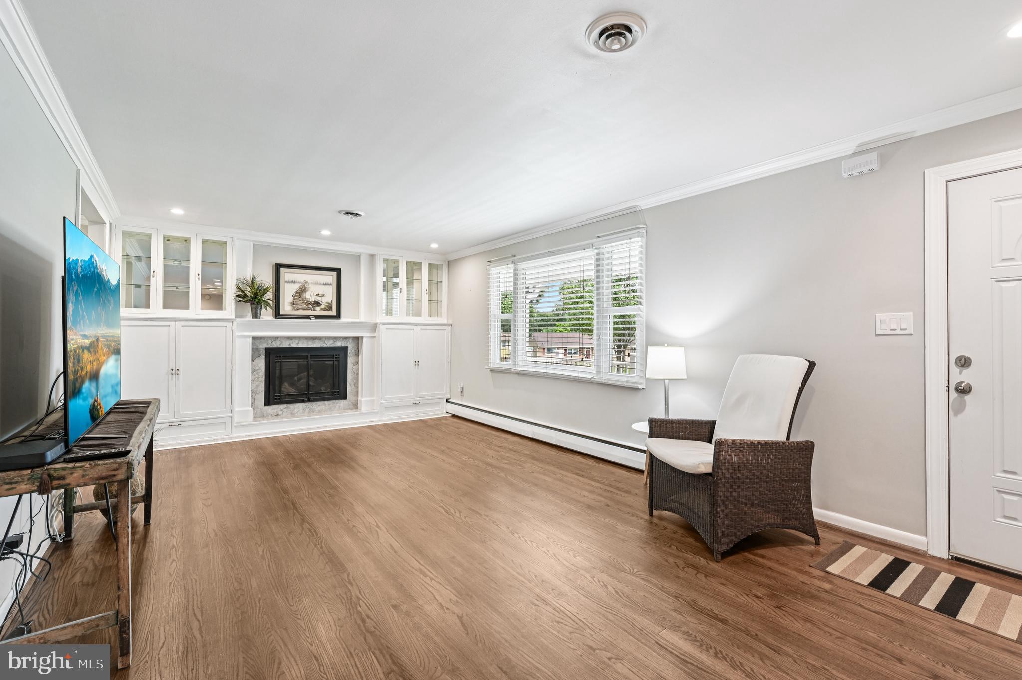 536 Maple Ridge Lane Odenton, MD 21113 - Photo 6 of 48 a living room with furniture and a fireplace