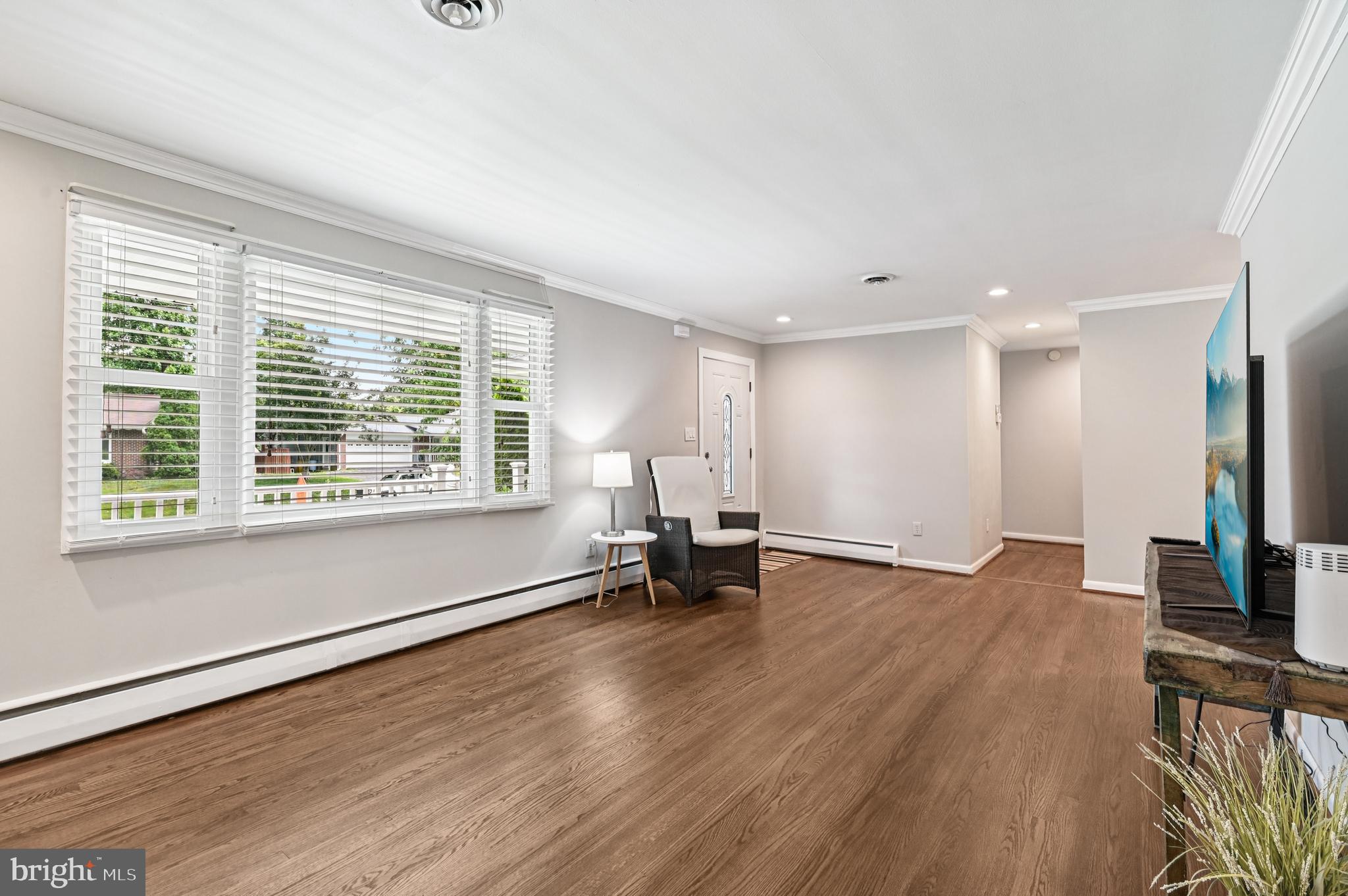 536 Maple Ridge Lane Odenton, MD 21113 - Photo 7 of 48 a view of empty room with wooden floor and a window