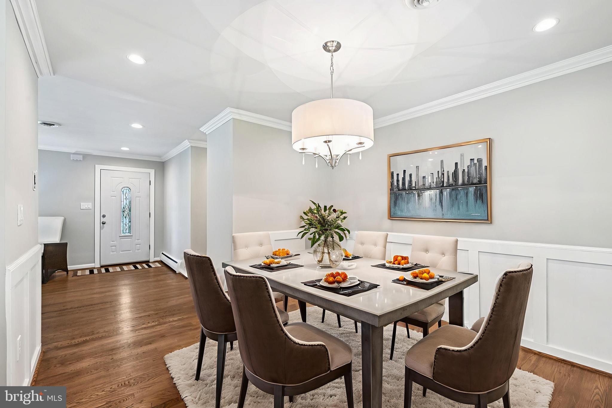 536 Maple Ridge Lane Odenton, MD 21113 - Photo 8 of 48 a view of a dining room with furniture wooden floor and chandelier