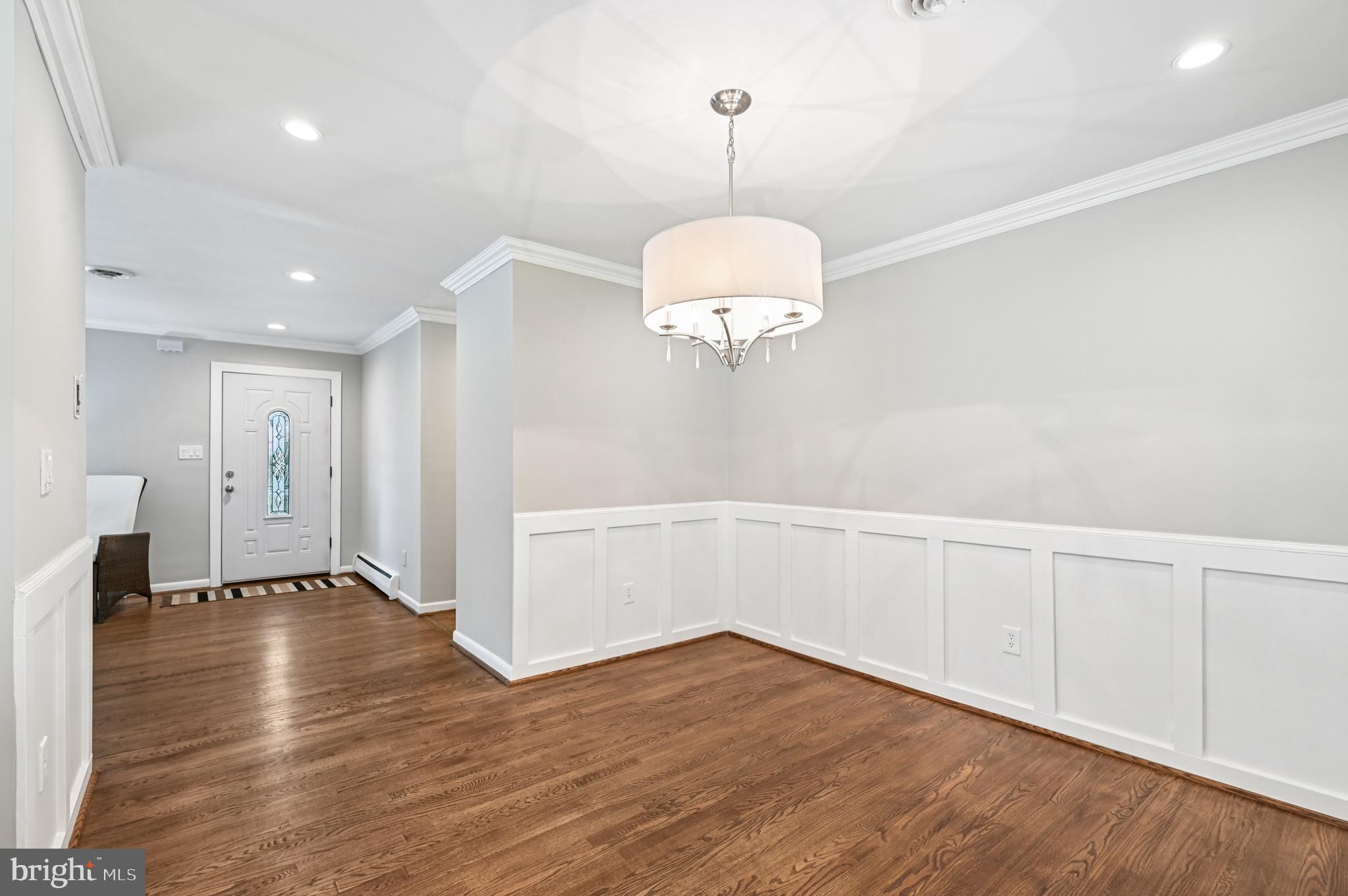 536 Maple Ridge Lane Odenton, MD 21113 - Photo 9 of 48 a view of an empty room with wooden floor