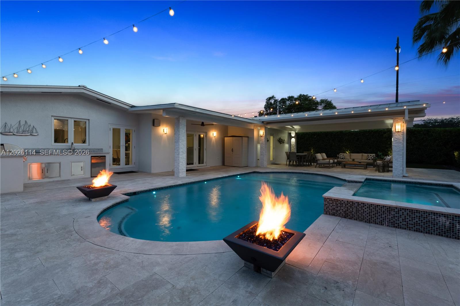 9641 Southwest 66th Street Miami, FL 33173 - Photo 52 of 57 a view of a swimming pool with a patio