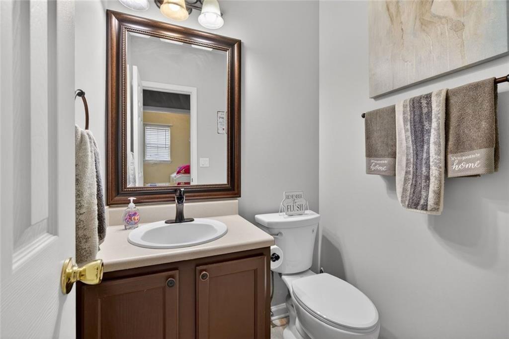 45 Windscape Drive Covington, GA 30016 - Photo 20 of 39 a bathroom with a toilet sink and mirror