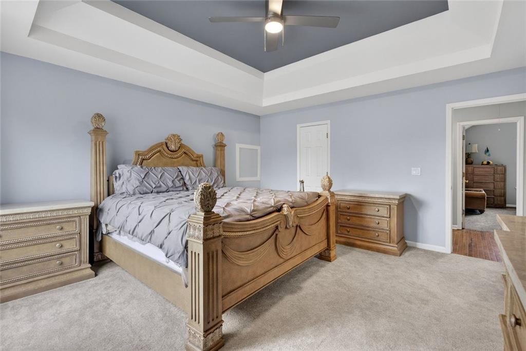 45 Windscape Drive Covington, GA 30016 - Photo 22 of 39 a bedroom with a bed and a desk