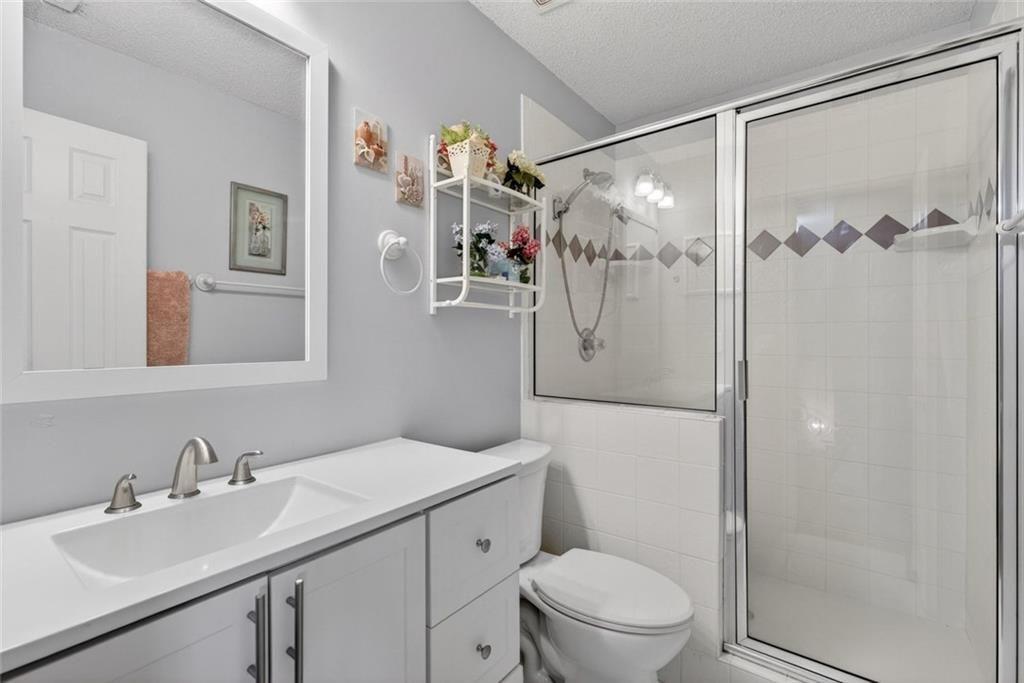 45 Windscape Drive Covington, GA 30016 - Photo 28 of 39 a bathroom with a sink toilet and shower