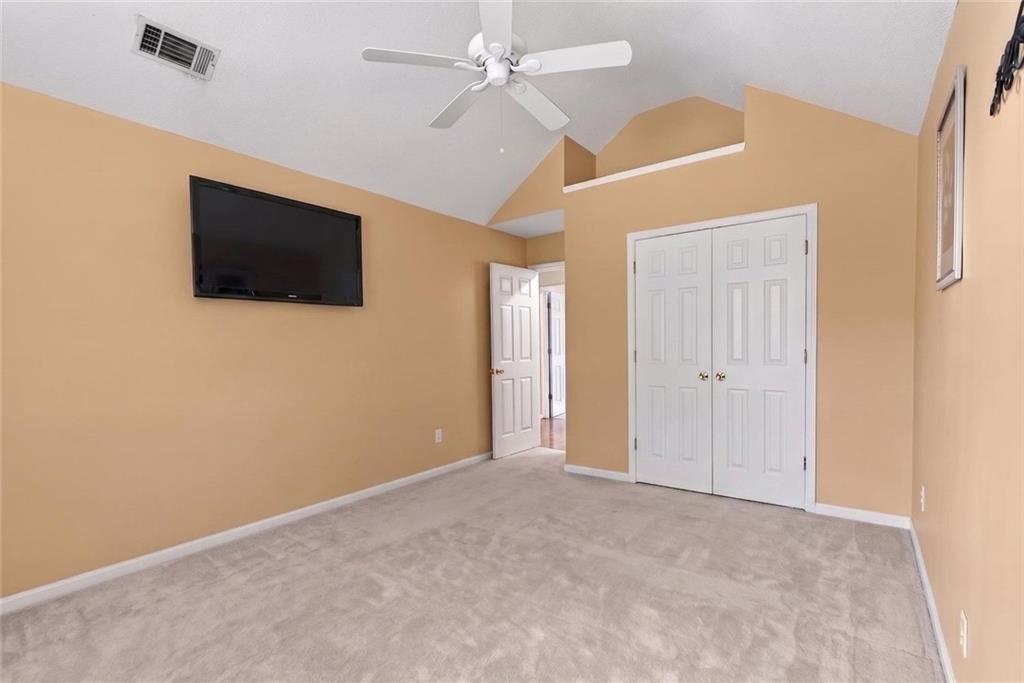 45 Windscape Drive Covington, GA 30016 - Photo 30 of 39 a view of an empty room with a ceiling fan