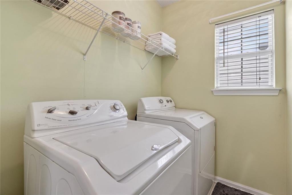 45 Windscape Drive Covington, GA 30016 - Photo 31 of 39 a utility room with dryer and washer
