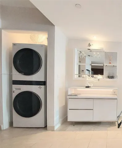 a bathroom with a sink a mirror and a shower