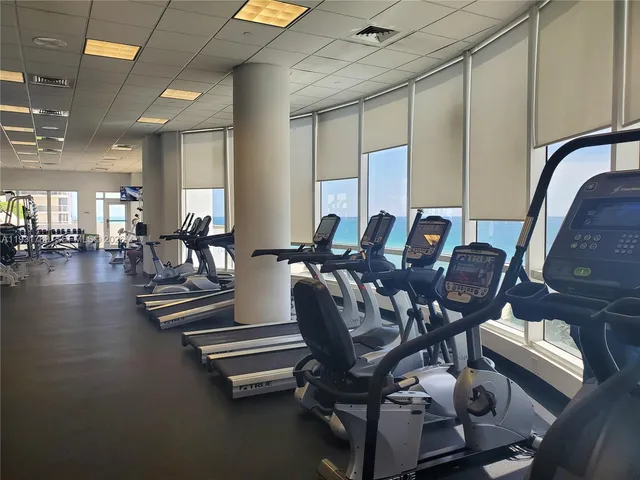 a view of swimming pool with outdoor seating and plants