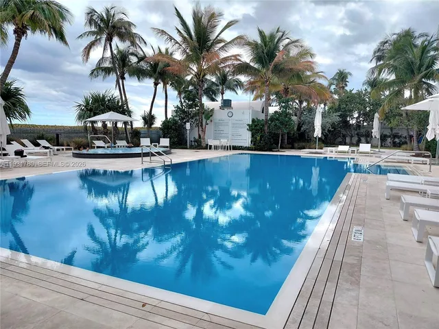 a front view of a building with swimming pool