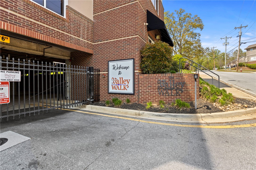101 Oak Street, Unit 401 Clemson, SC 29631 - Photo 2 of 26 This residential entrance features a brick exterior and gated entry.