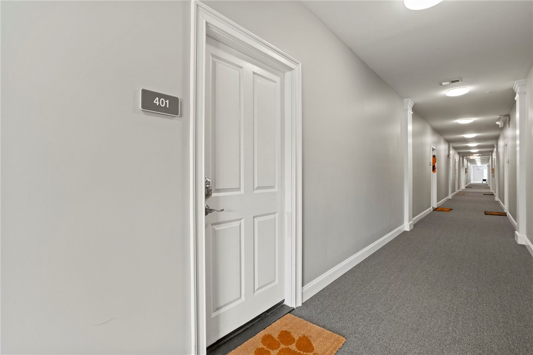 101 Oak Street, Unit 401 Clemson, SC 29631 - Photo 3 of 26 Welcome home to this inviting entrance foyer with warm lighting and plush carpeting.