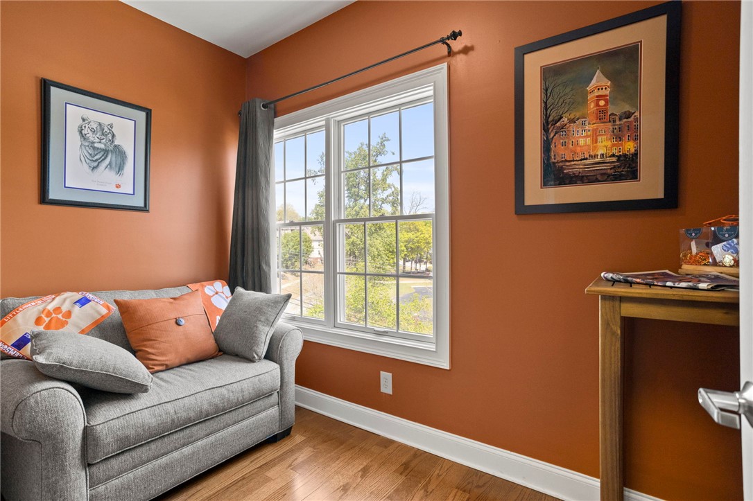 101 Oak Street, Unit 401 Clemson, SC 29631 - Photo 8 of 26 This inviting room offers a bright window and rich wood floors.
