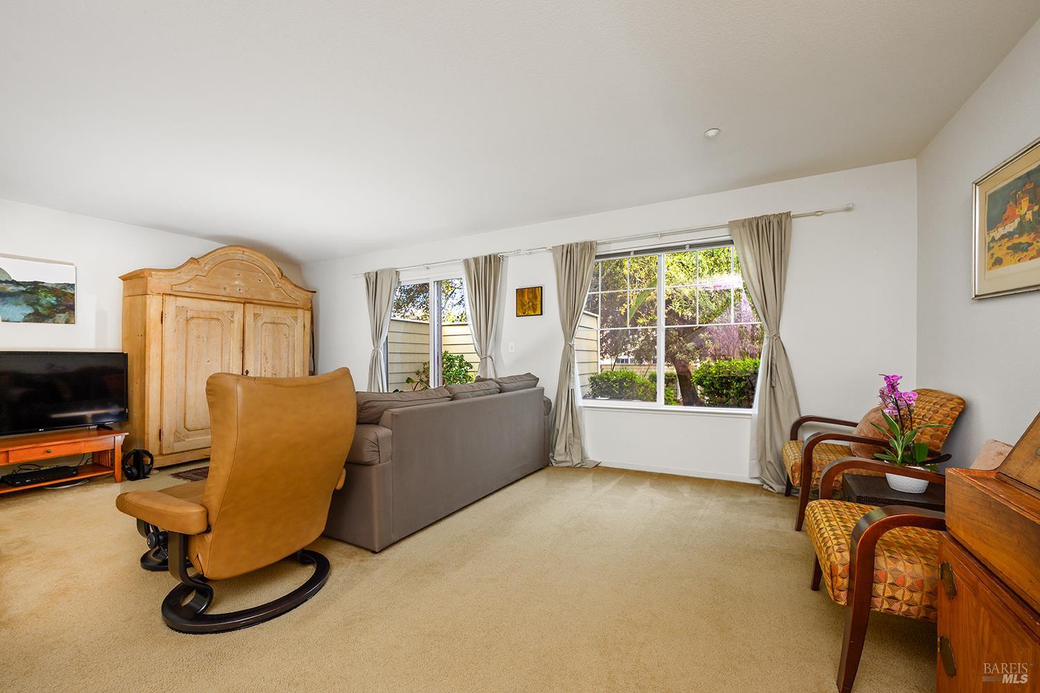 84 Crissy Place Novato, CA 94949 - Photo 15 of 37 a living room with furniture and a flat screen tv