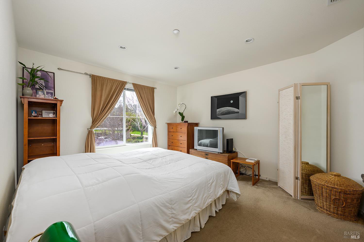84 Crissy Place Novato, CA 94949 - Photo 29 of 37 a bed room with a bed window and a television