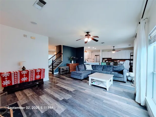 a living room with furniture and a couch