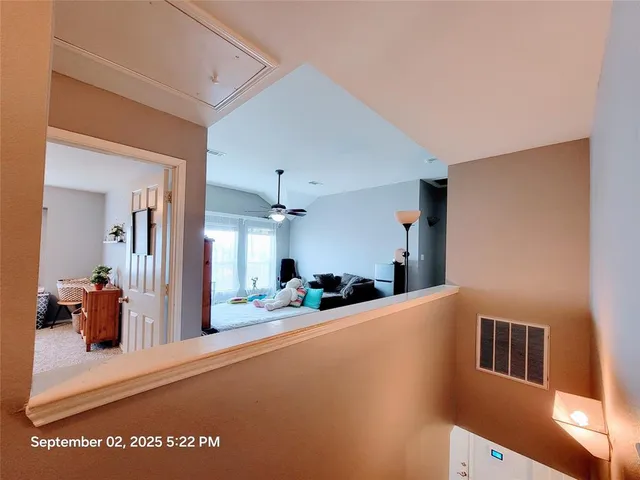a view of a living room and bathroom