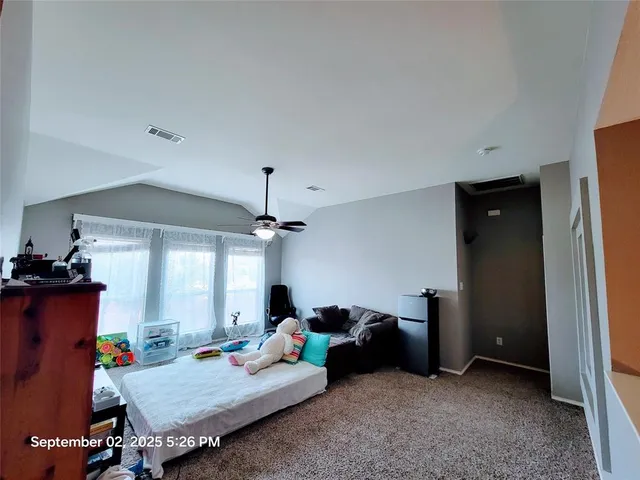 a bed room with furniture and a window