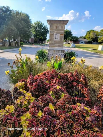 a view of a garden with a lake