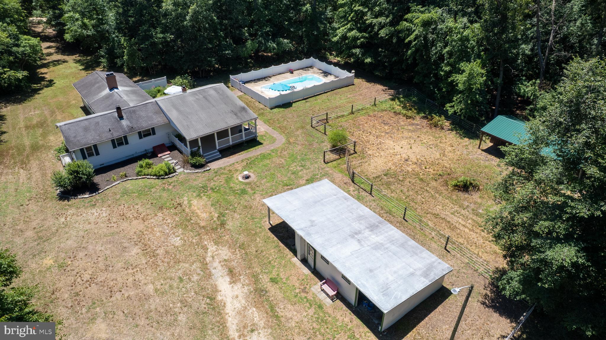 23130 Sparks Road Ridgely, MD 21660 - Photo 72 of 74 an aerial view of a house with a yard and trees