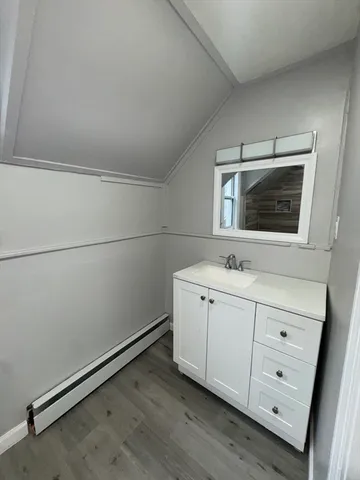 a room with a white cabinets and sink