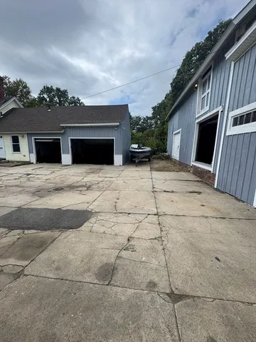 a backyard of a house with garage and garage