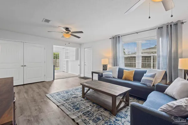 a bedroom with a bed and a couch