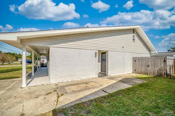 an aerial view of house with yard swimming pool and outdoor seating