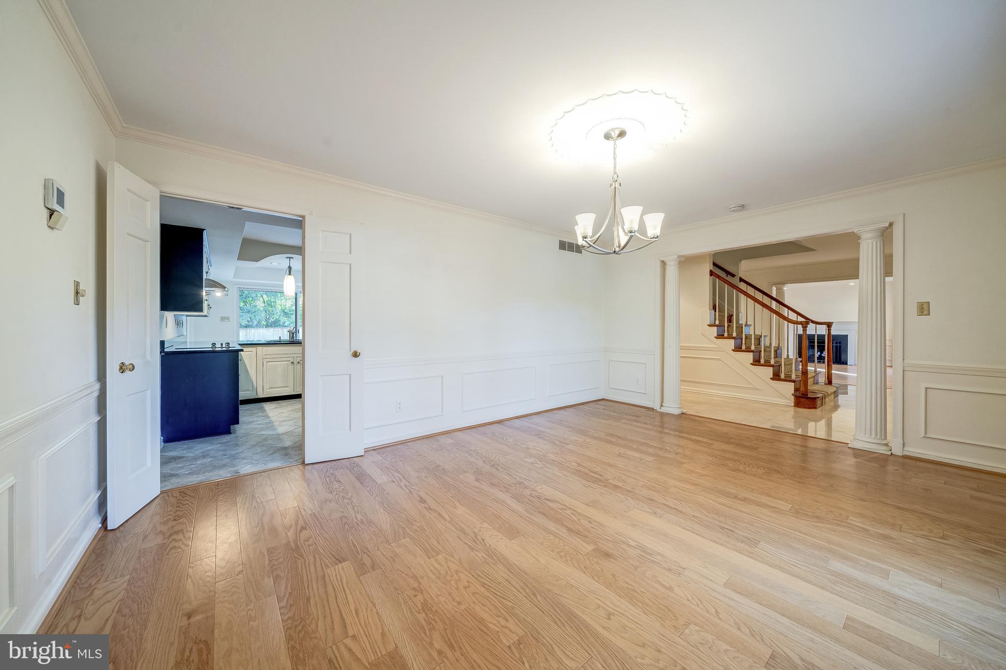 6209 Stoneham Lane McLean, VA 22101 - Photo 11 of 49 a view of a livingroom with a chandelier