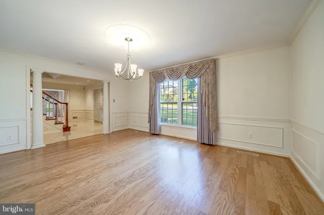 a view of a kitchen with large windows