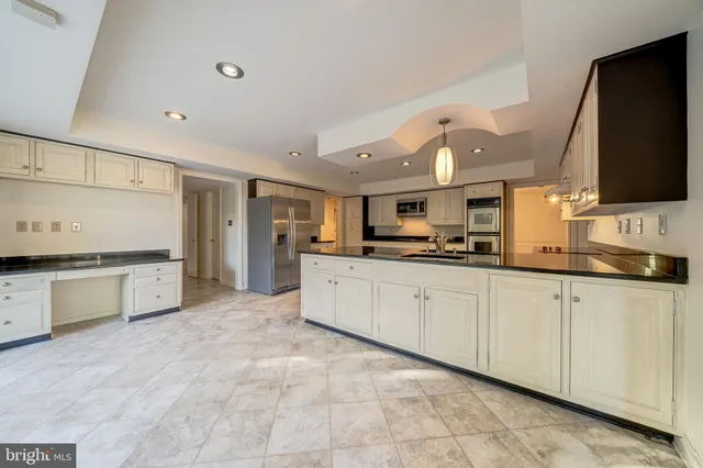 a large kitchen with cabinets
