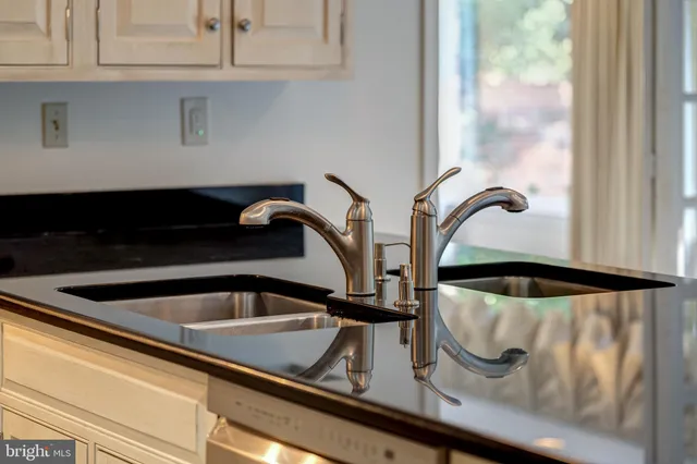 an empty room with windows and entryway