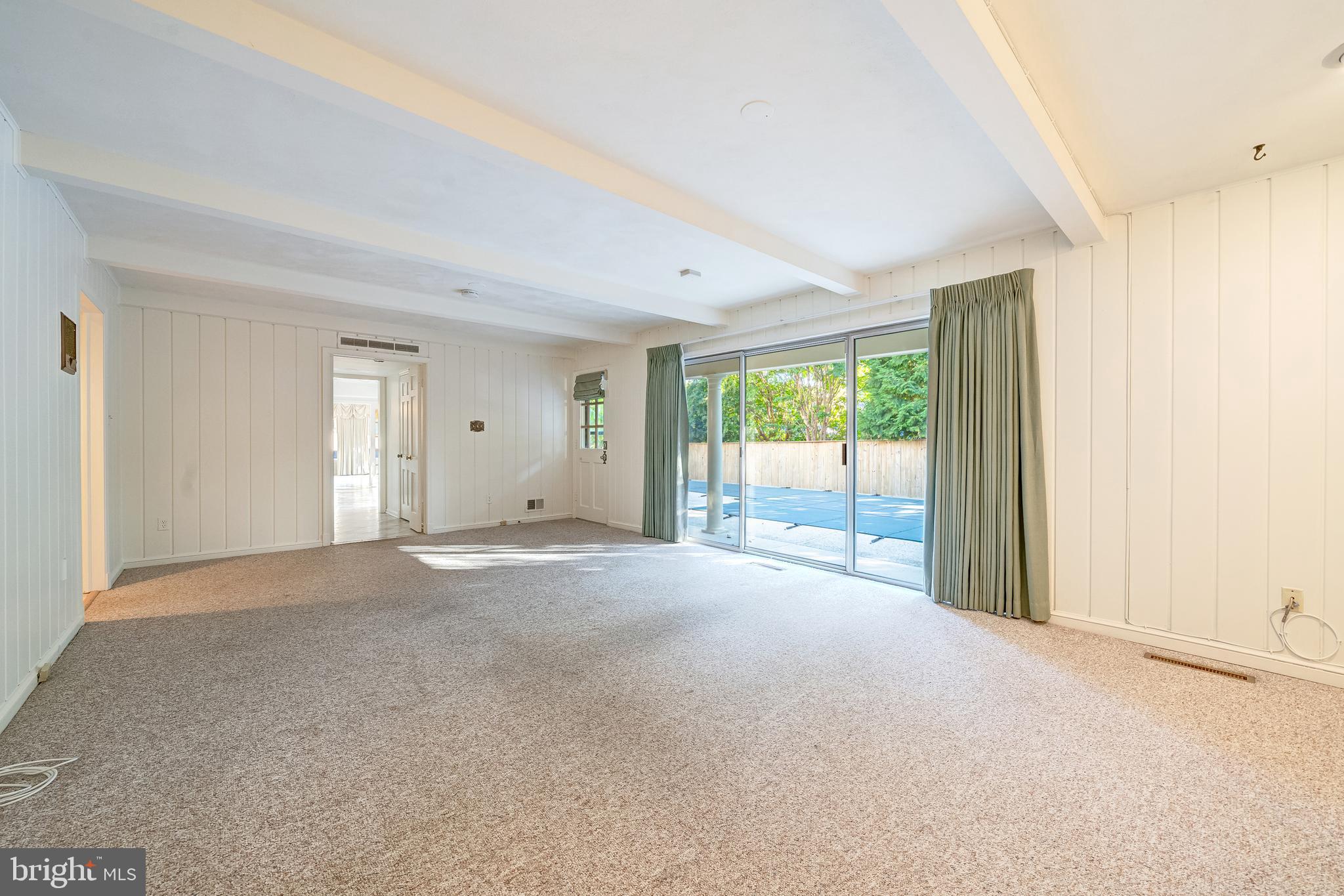 6209 Stoneham Lane McLean, VA 22101 - Photo 25 of 49 a view of a big room with windows and chandelier fan